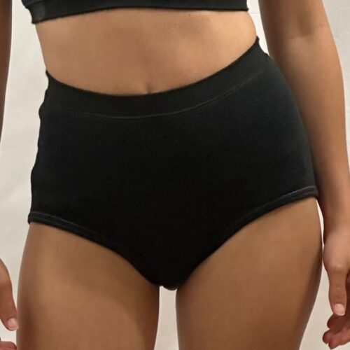 Woman wearing Seraphina Safety's Women's Essential Flame Resistant (FR) Tech™ Briefs.